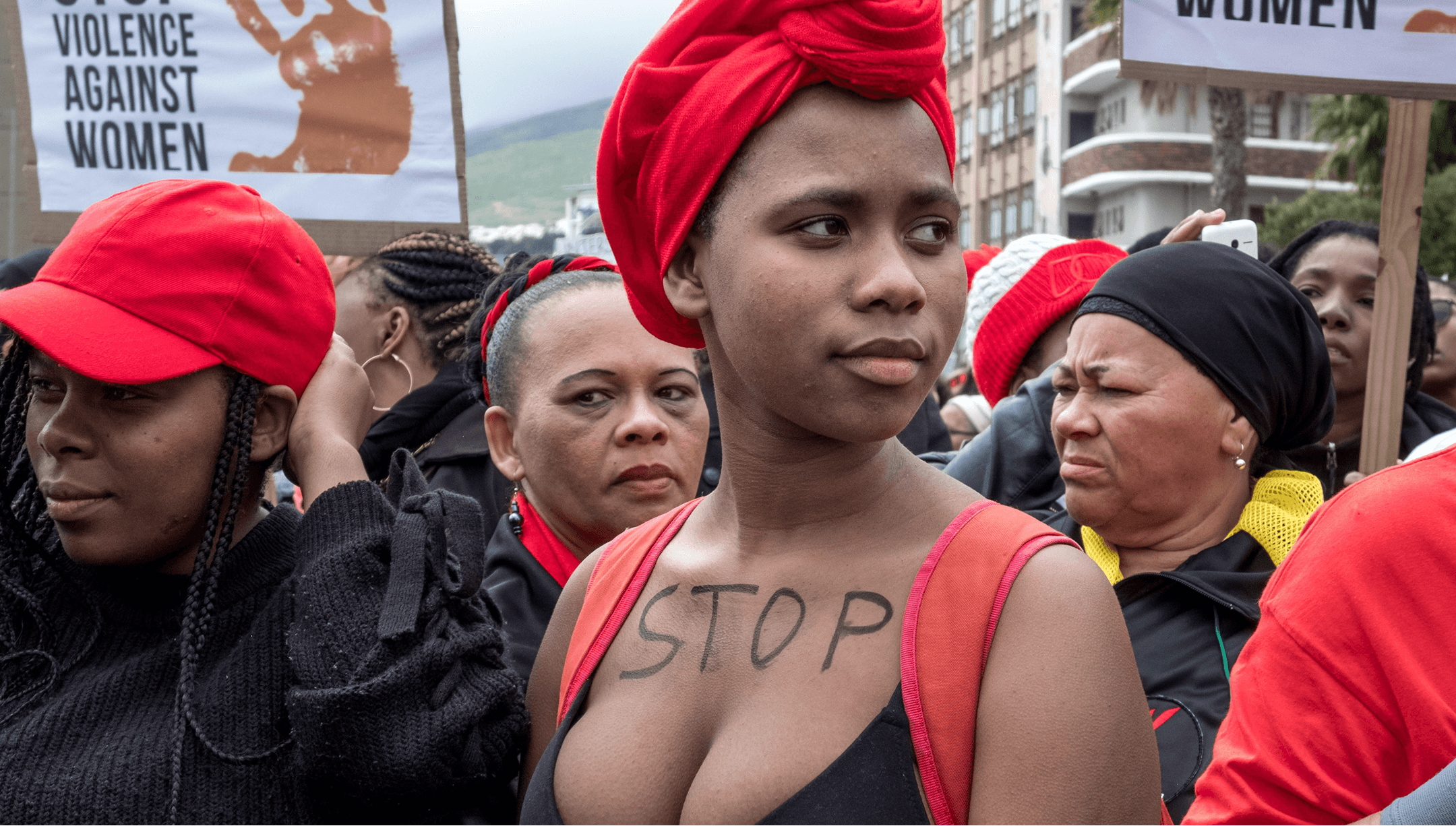 Protest photo of Women with 'STOP' written on chest